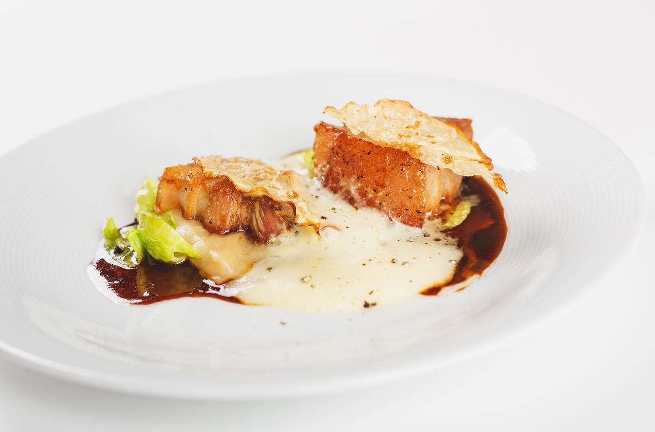 Retro Riverside Wellness Resort Karlovy Vary Esterno foto A prepared dish of monkfish
